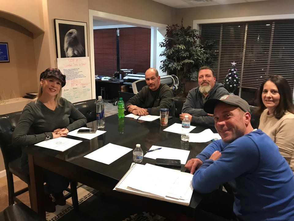 A client company holding its first management team meeting