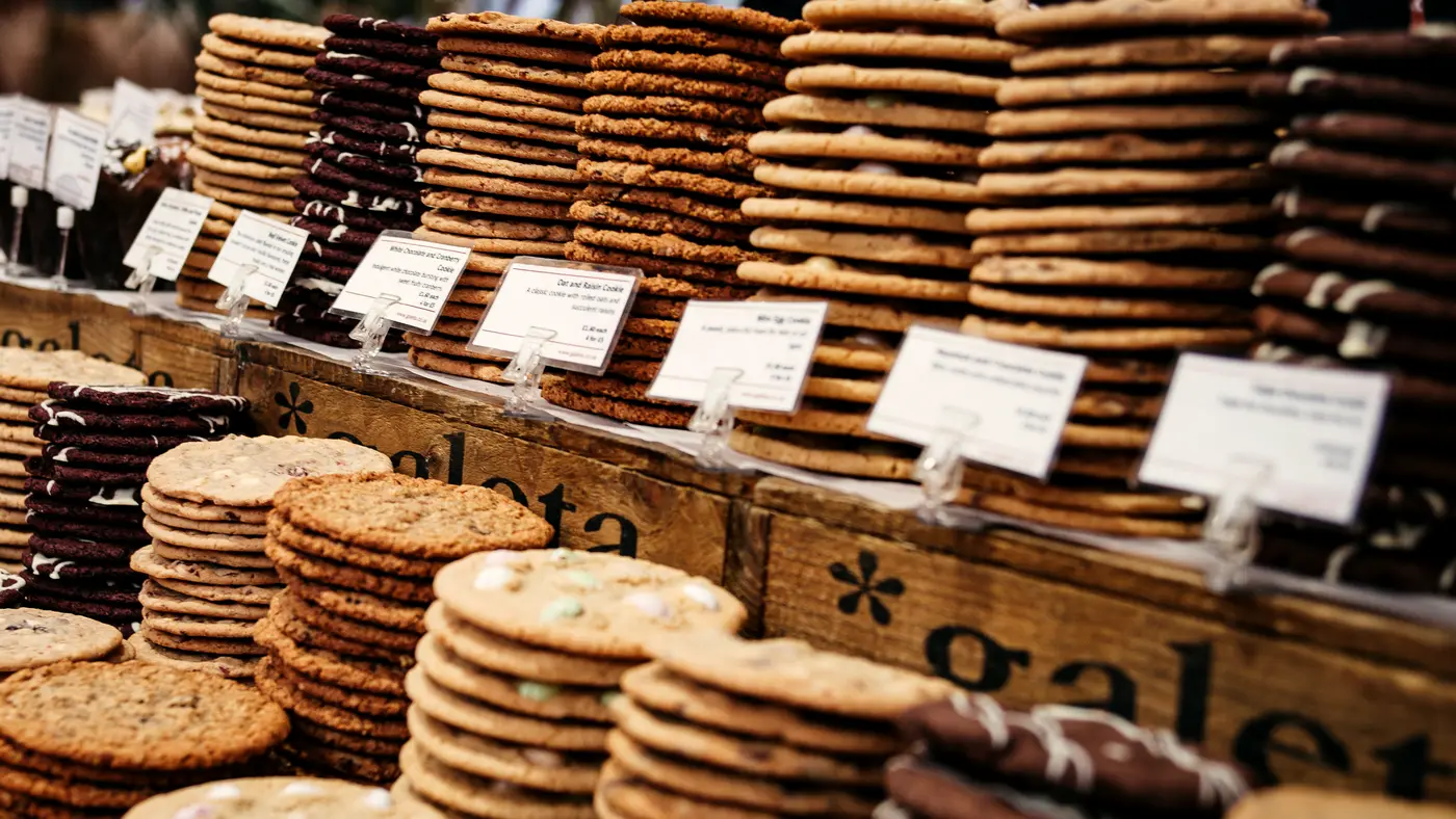 Stacks of cookies on a counter, each with a price tag