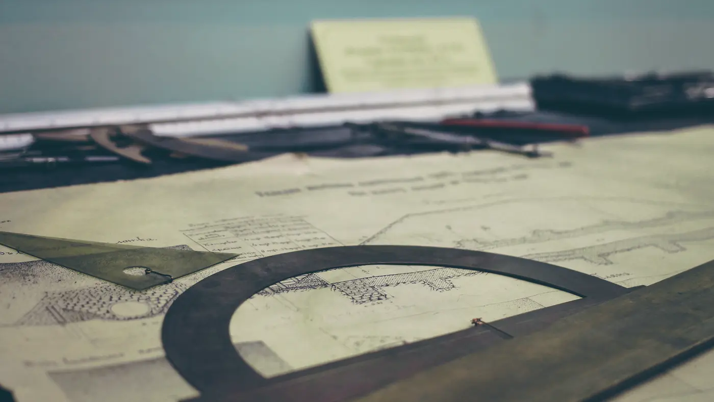 Technical drawing and drafting tools on a drawing table