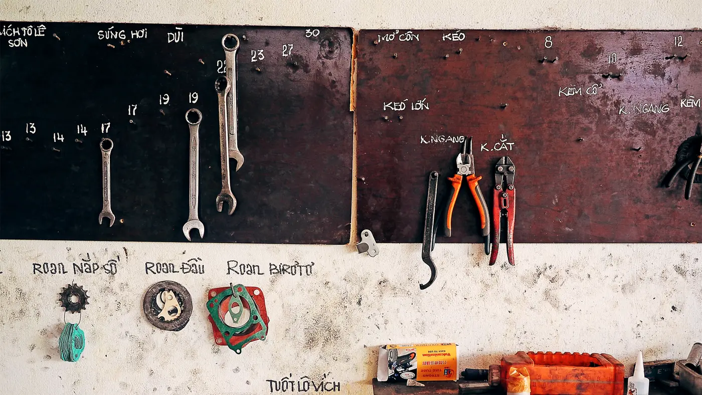 Hand tools hung in order on a workshop wall